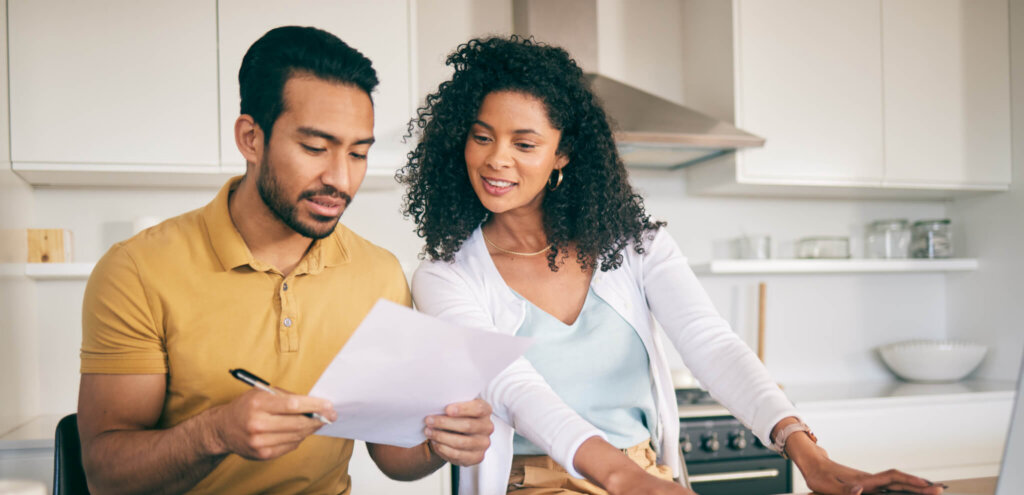 Intended parents review surrogacy agreement paperwork.
