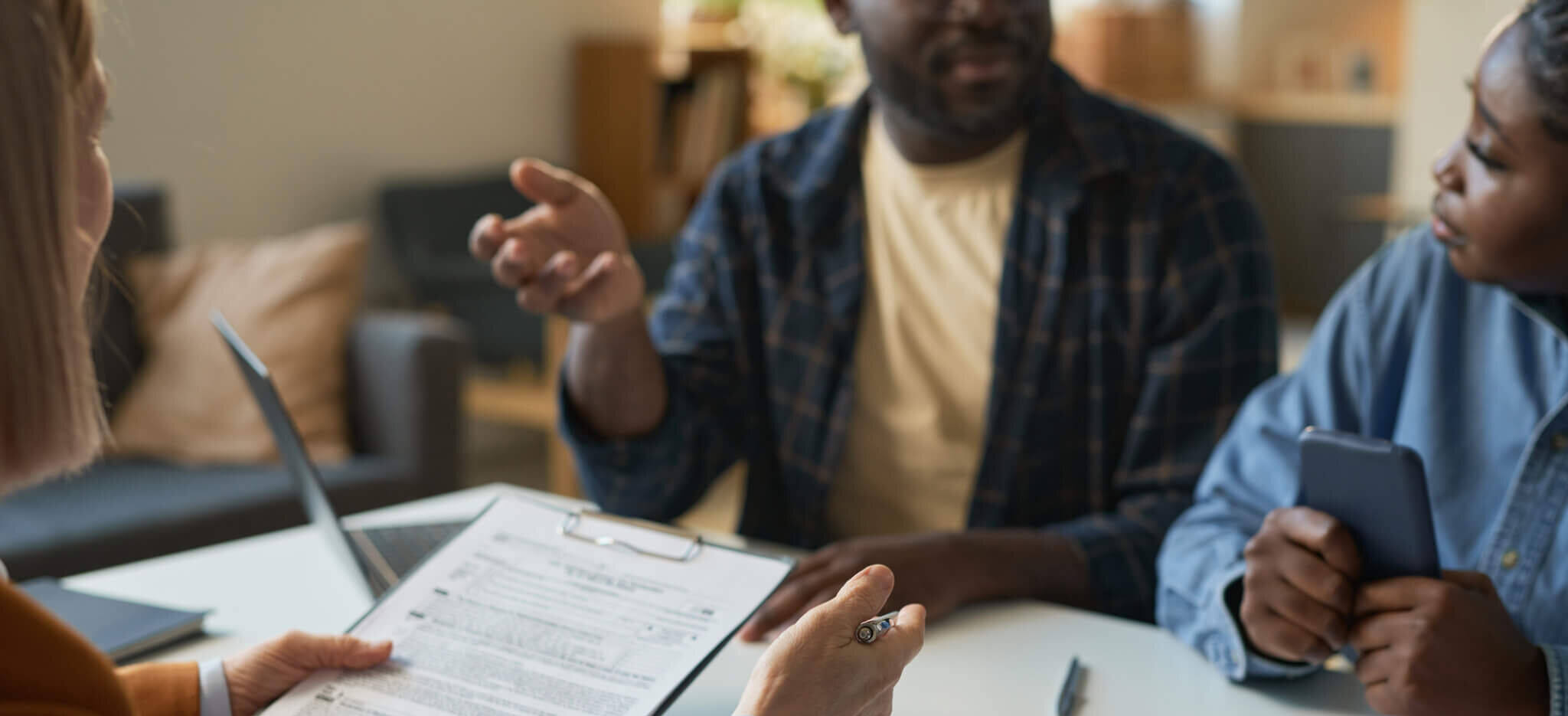 A couple talks to an attorney while drafting an embryo disposition agreement.
